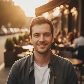 The same man at a café terrace in golden-hour light