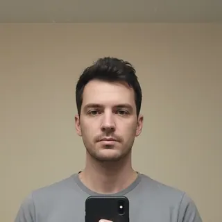 A plain selfie against a wall